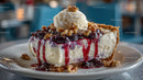 Cheesecake Slice with Ice Cream and Berry Sauce
