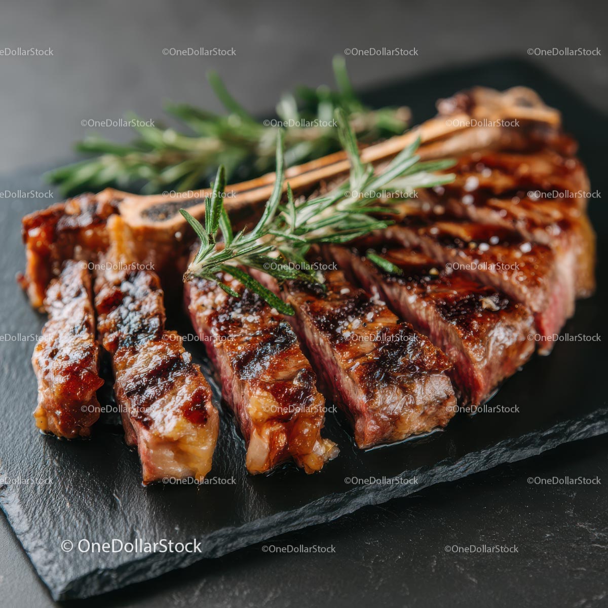Grilled Ribeye Steak with Fresh Rosemary Garnish