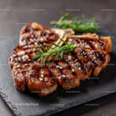 Grilled Juicy Steak with Rosemary Garnish on Slate