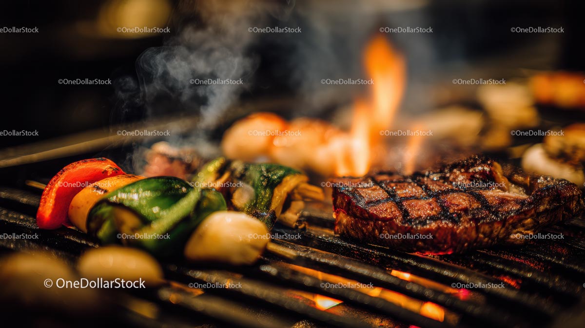 Grillowany stek i warzywa na gorącym grillu BBQ