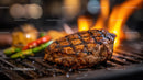 Juicy Grilled Steak on Flaming BBQ Grill