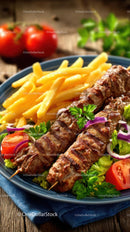 Grilled Kebab and Crispy Fries with Fresh Vegetables