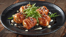 Glazed Chicken Bites with Sesame and Arugula Garnish