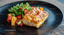 Grilled Fish with Fresh Vegetables on Black Plate