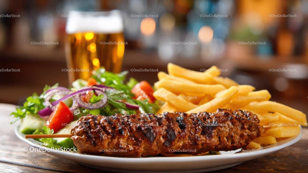 Grilled Kebab with Salad and Fries on Rustic Table