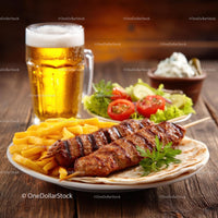 Grilled Kebab with Fries and Fresh Salad on a Wooden Table