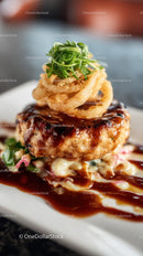 Gourmet Burger with Onion Rings and Herb Garnish