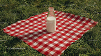 Milk Bottle on Red Checkered Picnic Blanket in Sunny Meadow