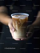 Hands Holding Iced Coffee in Plastic Cup