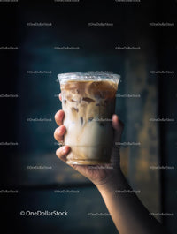 Iced Coffee in Hand with Creamy Layers