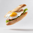 Fried Egg Baguette Sandwich on White Background