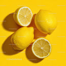 Fresh Lemons on a Bright Yellow Background