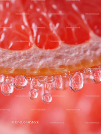 Close-Up of Juicy Grapefruit Slice with Droplets