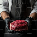 Butcher Holding Fresh Raw Beef in Black Gloves