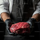 Butcher Holding Fresh Raw Beef Steak