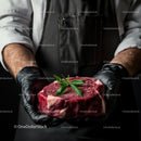 Chef Holding Fresh Raw Steak with Garnish