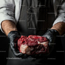 Butcher Holding Fresh Marbled Beef Steak