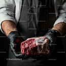Butcher Holding Fresh Beef Steak in Black Gloves
