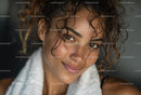 Smiling Woman with Curly Hair and Natural Glow