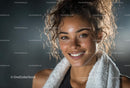 Smiling Woman with Towel After Exercise