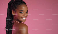 Smiling Woman with Braids Against Pink Background