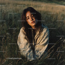 Peaceful Woman in a Sunlit Wheat Field at Dusk