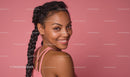 Smiling Woman with Braided Hair in Pink Top