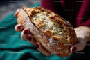 Crusty Sourdough Bread Held in Hands