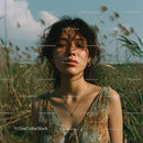Bohemian Woman in a Tranquil Field Setting