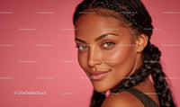 Portrait of Smiling Woman with Braided Hair on Pink Background