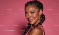 Smiling Woman with Braided Hair on Pink Background