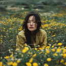 Woman in a Meadow of Yellow Wildflowers