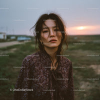 Pensive Woman in Cozy Sweater at Sunset