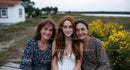 Three Generations of Women with Yellow Wildflowers
