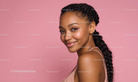 Confident Woman With Braided Hair on Pink Background
