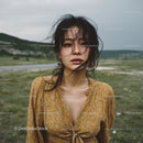 Young Woman in Yellow Dress in Breezy Open Field