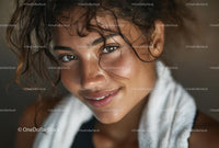 Smiling Woman with Curly Hair and Towel