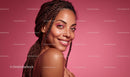 Smiling Woman with Braided Hair on Pink Background