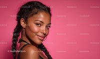 Smiling Woman with Braided Hair Against Pink Background