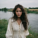 Young Woman in a Light Summer Dress by the Riverside