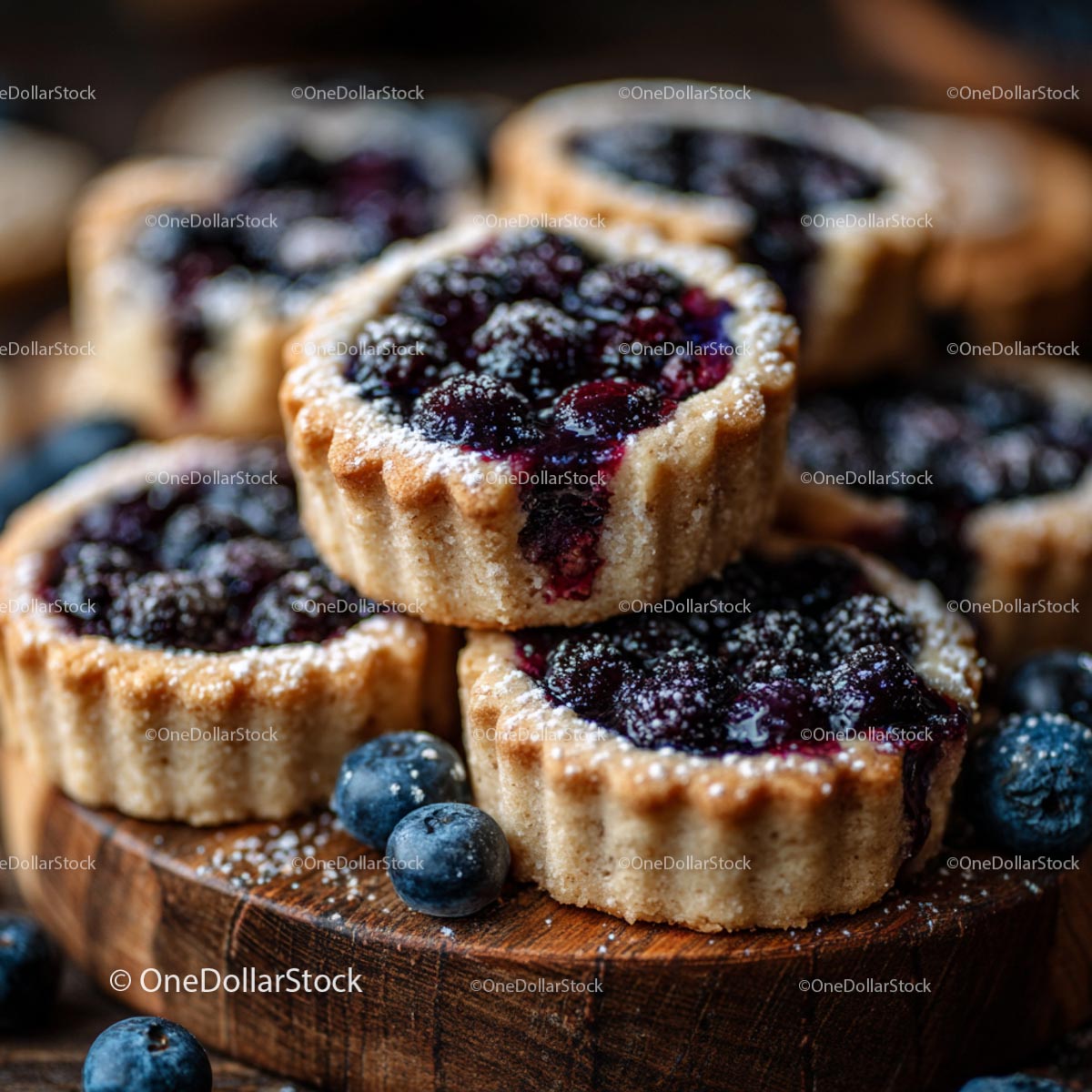 Blueberry Tarts on Rustic Wooden Board