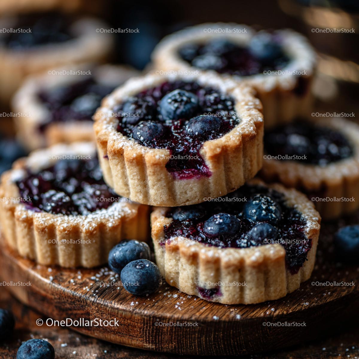 Fresh Blueberry Tarts with Powdered Sugar Topping