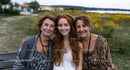 Three Generations of Women Smiling in Nature