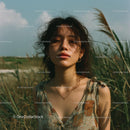 Sunlit Woman in a Serene Grassy Field Outdoors