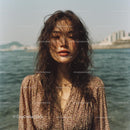 Casual Portrait of Woman by the Sea with Ocean Breeze