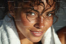 Sunlit Portrait of Smiling Woman with Curly Hair and Freckles