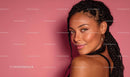 Confident Woman with Braided Hair on Pink Background