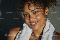 Smiling Woman with Curly Hair and Towel in Sunlight