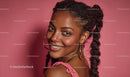 Confident Woman with Braided Hair and Hoop Earrings