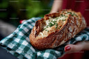 Crusty Bread Loaf with Chives on Checkered Cloth
